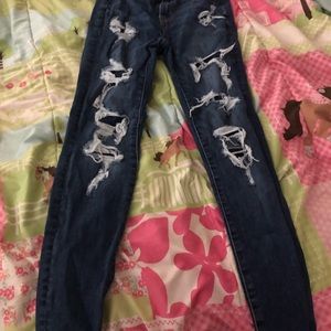 American Eagle ripped jeans size 0 tapered yon bottom